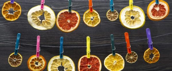 Lines of Dried Citrus Safety Pinned to String | Vitacost Blog