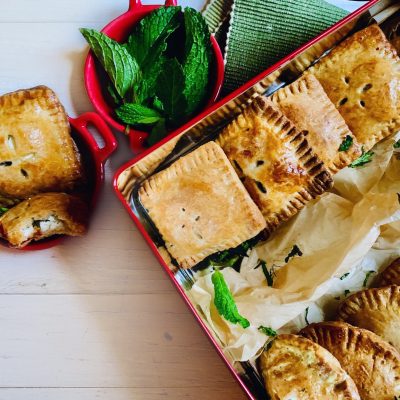 Red Pan with Rows of Baked Hand Pies Next to Single Hand Pie in Cup | Vitacost Blog