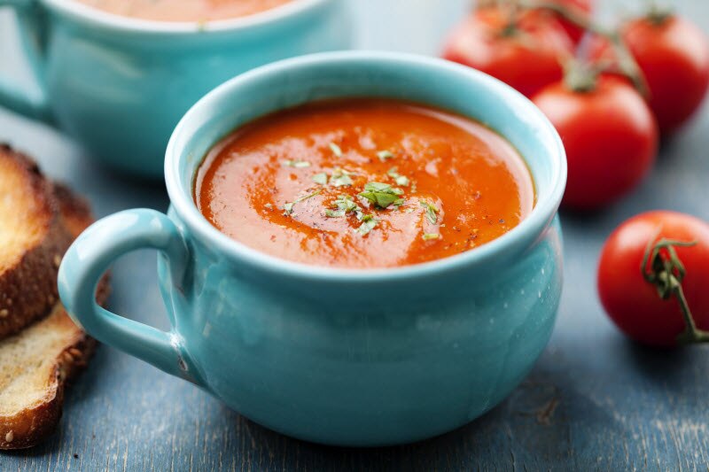 What is Lycopene Represented by Blue Mug of Tomato Soup Surrounded by Fresh Tomatoes | Vitacost.com/blog