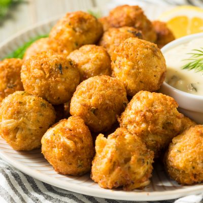 Bowl of Breaded Crab Bites Next to Bowl of Dipping Sauce | Vitacost Blog