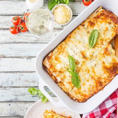 Top View Lasagna in White Dish on White Wood Background | Vitacost Blog
