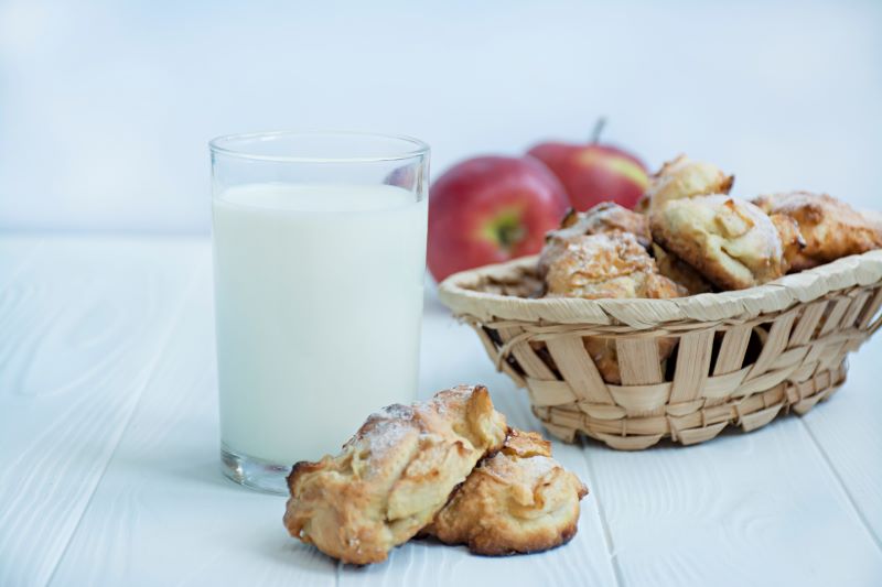 Apple Fritters in Basket on White Wood Table with Apples and Milk | Vitacost.com/blog