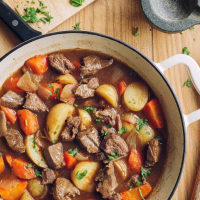 Beef Stew in White Pot on Wood Table | Vitacost.com/blog