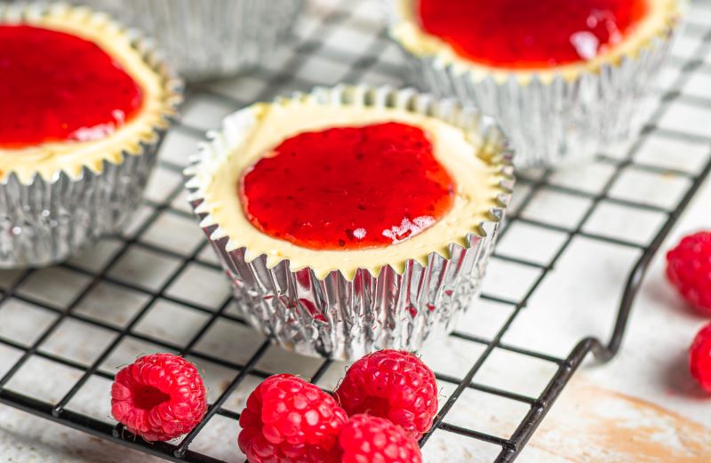 Mini Raspberry-Topped Cheesecakes in Silver Liners on Cooling Rack | Vitacost.com/blog