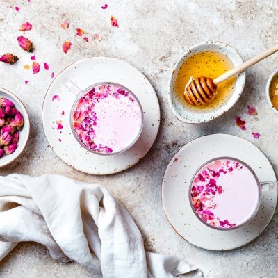 Pink Rose-Hibiscus Moon Milk Garnished with Edible Rose Petals | Vitacost Blog