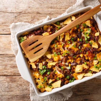 Nacho Casserole in White Baking Dish on Wood Table | Vitacost.com/blog