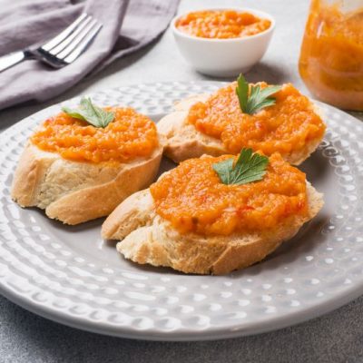 Carrot Purée (Carrot “Caviar”) Toast Recipe on French Bread Baguette on White Appetizer Plate | Vitacost.com/blog