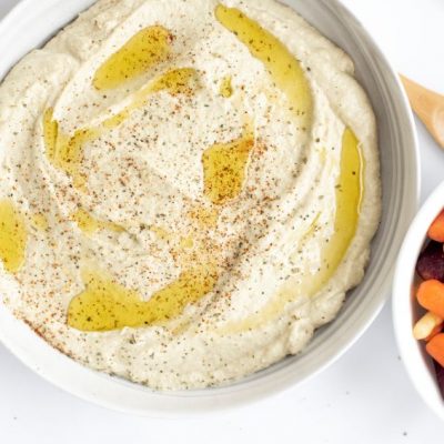 Artichoke Vegan Hummus in White Bowl Next to Carrot & Veggie Bowl | Vitacost.com/blog