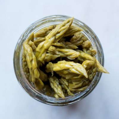 Easy Pickled Asparagus in Mason Jar on White Countertop | Vitacost.com/blog