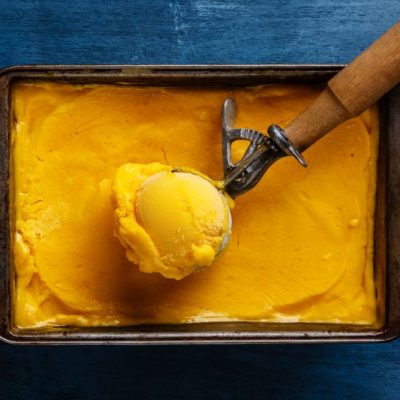 Vegan Golden Milk Ice Cream in Pan with Vintage Scoop on Denim Blue Cloth | Vitacost.com/blog