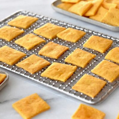 Vegan Cheez Its Crackers in a Row on Silver Metal Cooling Rack | Vitacost.com/blog