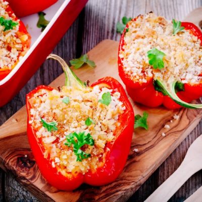 Quinoa & Veggie Healthy Stuffed Bell Peppers on Wood Cutting Board | Vitacost.com/blog