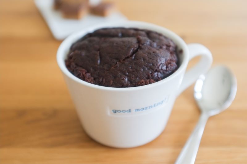 Keto Chocolate Mug Cake in White Mug on Wood Tabletop | Vitacost.com/blog