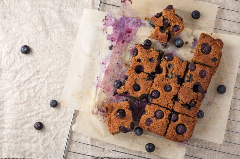 Gluten Free Blondies with Blueberries on Parchment Paper | Vitacost.com/blog