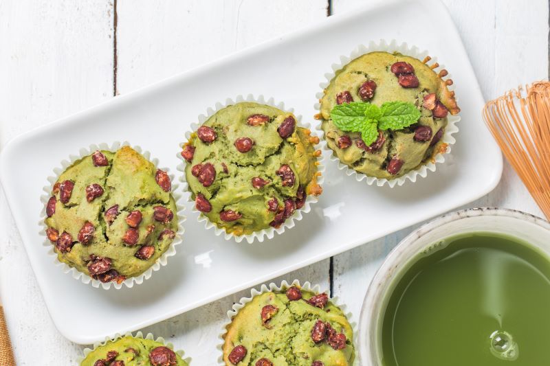 Gluten Free Pistachio & Matcha Muffins on White Serving Plate with Cup of Matcha Tea | Vitacost.com/blog