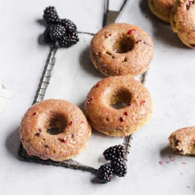 Homemade Gluten-Free Glazed Blackberry Donuts on Cooling Rack with Fresh Blackberries | Vitacost.com/Blog