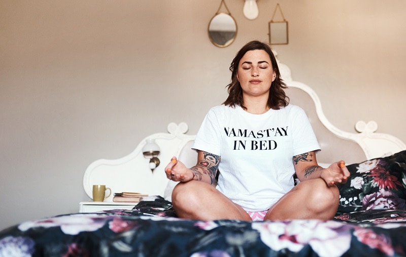 Woman Practicing Yoga Stretches for Better Sleep | Vitacost.com/Blog