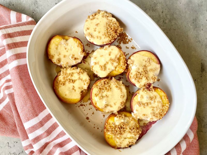 Cheesecake Baked Peaches in White Serving Dish with Linen Napkin | Vitacost.com/blog