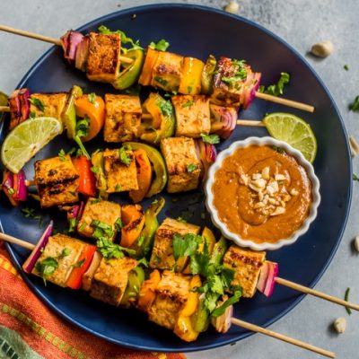 Grilled Kebabs Stacked with Tofu and Veggies on Plate with Chili-Garlic Peanut Dipping Sauce | Vitacost.com/Blog