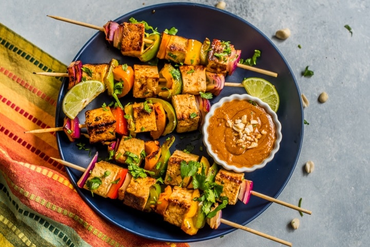 Grilled Kebabs Stacked with Tofu and Veggies on Plate with Chili-Garlic Peanut Dipping Sauce | Vitacost.com/Blog