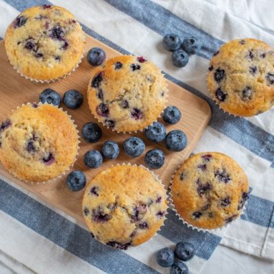 Vegan Blueberry Muffins on Wooden Serving Board with Linen Napkin | Vitacost.com/Blog