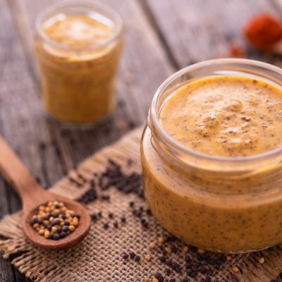 Homemade Yellow Mustard Recipe in Jar on Burlap with Mustard Seeds | Vitacost.com/blog