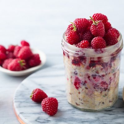 Mason Jar Filled with Overnight Oatmeal, Raspberry Puree and Fresh Raspberries | Vitacost.com/Blog