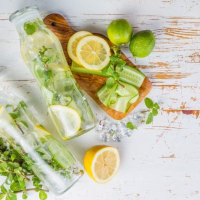 Collagen Spa Water With Cucumber, Lemon & Mint in Resealable Glass Bottles on White Counter | Vitacost.com/blog
