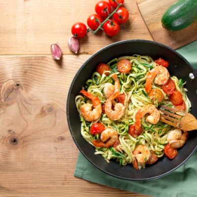 Easy Zucchini Noodles with Shrimp & Cherry Tomatoes in Skillet on Wood Counter | Vitacost.com/blog