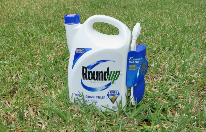 Weed Killer Roundup Containing Glyphosate Sitting on Lawn | Vitacost.com/blog