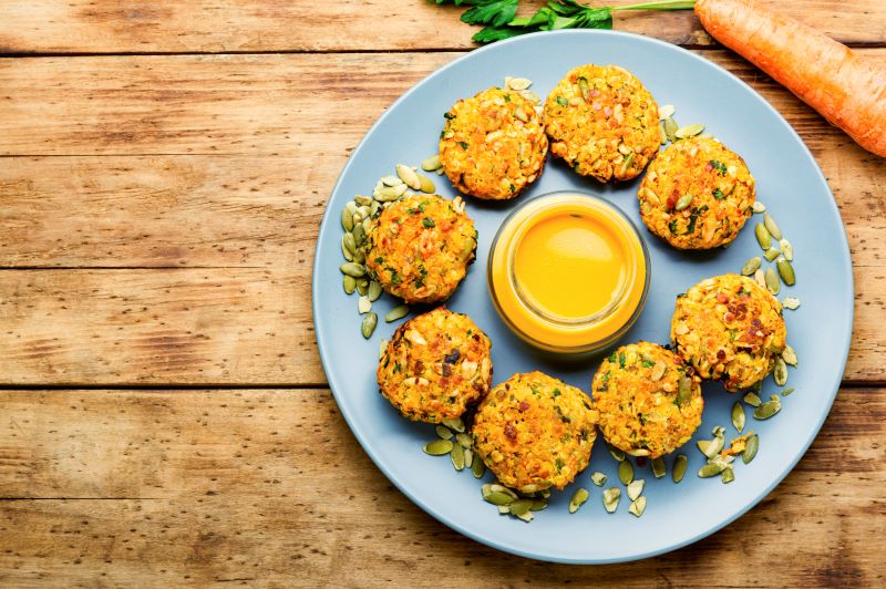 Sweet Potato & Lentil Patties With Ginger Sauce on Blue Plate | Vitacost.com/blog