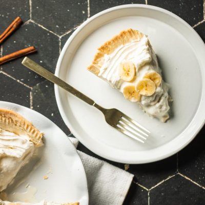 Slice of Vegan Banana Cream Pie on White Plate with Fork | Vitacost.com/Blog