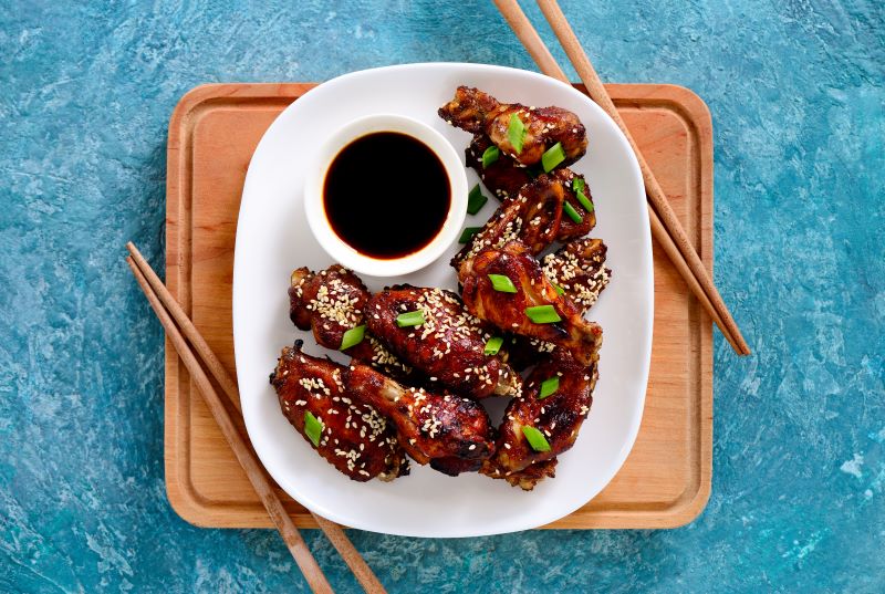 Plum Chicken Wings with Sesame Seeds & Green Onions on Plate | Vitacost.com/blog