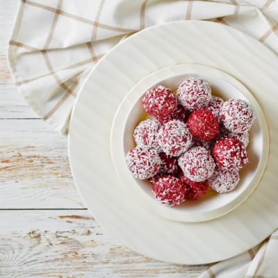Bliss Balls: Peanut Butter Oat Balls Made with Berries in a White Bowl on Wooden Table | Vitacost.com/blog