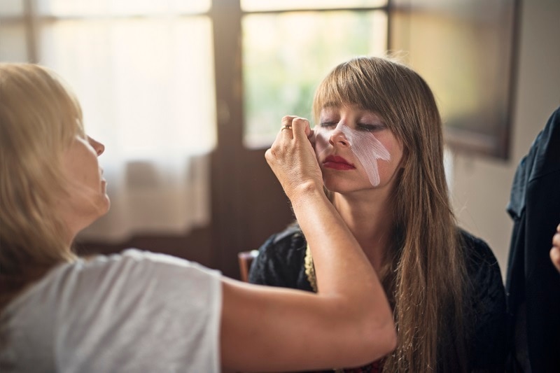Mother Applying All-Natural Do-it-Yourself Halloween Makeup on Daughter's Face | Vitacost.com/Blog