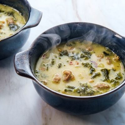Tuscan Kale Soup With Italian Sausage in Two Steaming Soup Bowls | Vitacost.com/blog