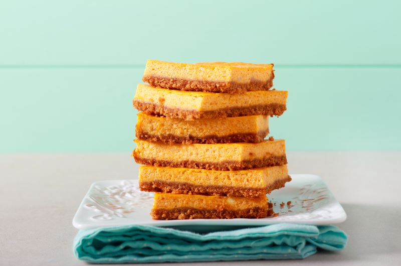 Vegan Pumpkin Cheesecake with Pecan Cookie Crust on White Plate With Napkin | Vitacost.com/blog