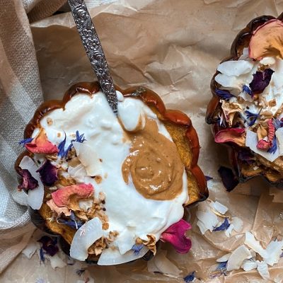 Homemade Acorn Squash Breakfast Bowl Topped with Greek Yogurt, Nut Butter, Granola, Edible Flowers and Coconut Flakes | Vitacost.com/Blog