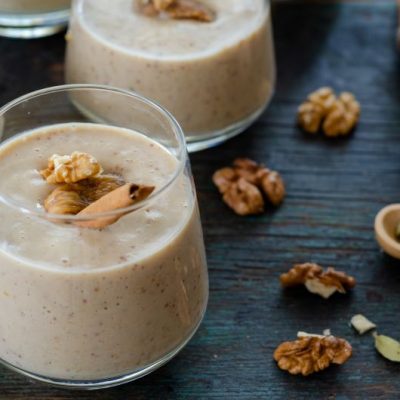 Coconut Milk Pudding With Fig in Glasses on Blue Wood Table with Walnuts & Cinnamon | Vitacost.com/blog