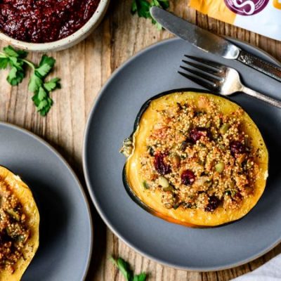 Quinoa Stuffed Acorn Squash on Stoneware Plates on Wood Table | Vitacost.com/blog