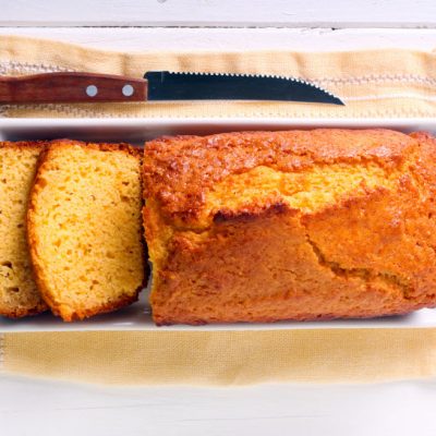 Homemade Apple-Cheddar Bread Loaf in White Pan with Knife | Vitacost.com/blog
