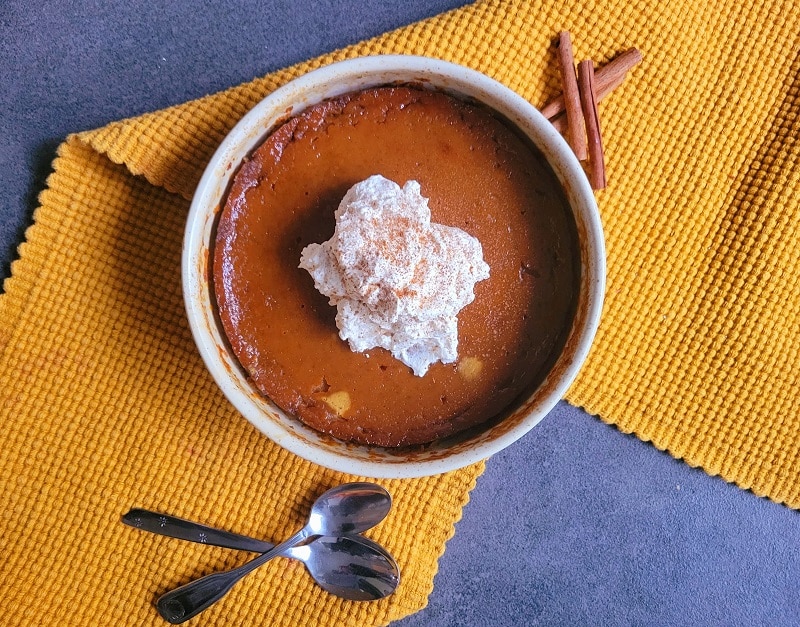 A Round Ceramic Baking Dish Filled With Pumpkin Pudding Recipe | Vitacost.com/Blog