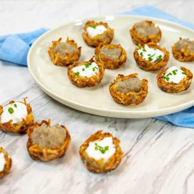 A Plate of Vegan Potato Latkes Shaped into Cups Filled With Applesauce and Sour Cream | Vitacost.com/Blog