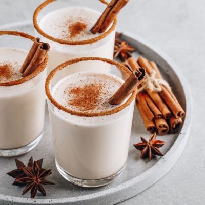 Coconut Milk Dairy Free Eggnog in Glasses with Cinnamon Sticks on Serving Tray | Vitacost.com/blog