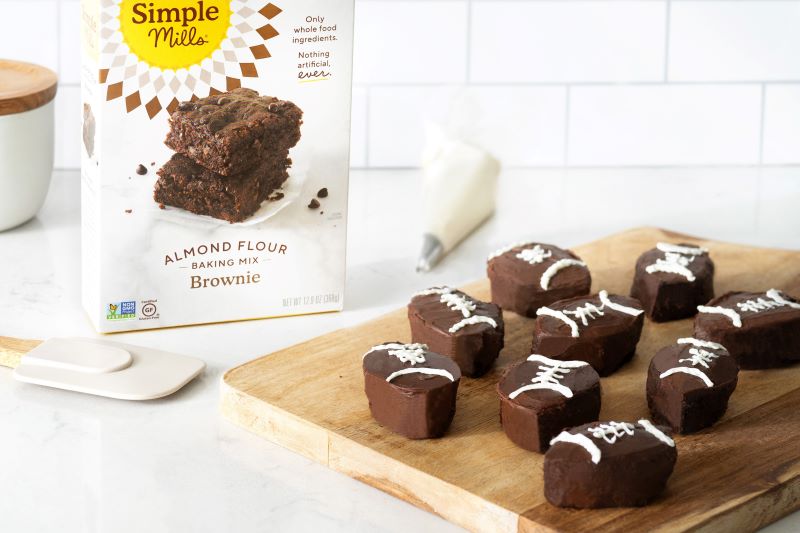 Football-Shaped Frosted Brownies on Wooden Serving Board | Vitacost.com/blog