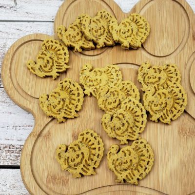 Leftover Turkey & Sweet Potato Dog Treats on Paw-Shaped Wooden Cutting Board | Vitacost.com/blog