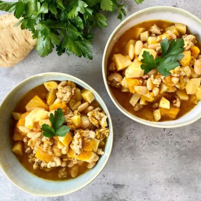 Chicken and Pumpkin Chili Recipe With Parsnips & Butternut Squash in Stoneware Bowls on Marble Counter | Vitacost.com/blog