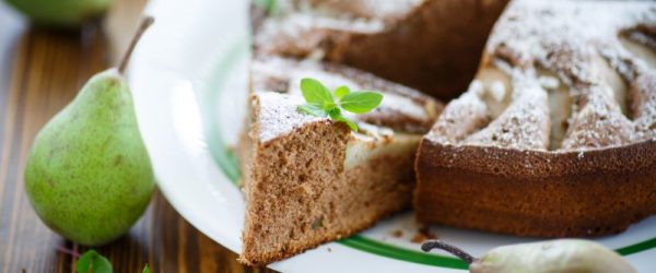 Spiced Pear Cake on Serving Plate with Whole Pears on Wood Tabletop | Vitacost.com/blog