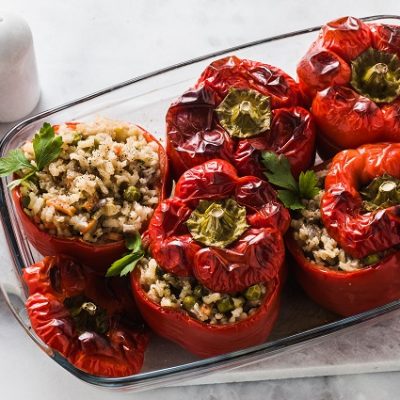 Vegetarian Stuffed Peppers in a Glass Dish on a Marble Table | Vitacost.com/Blog