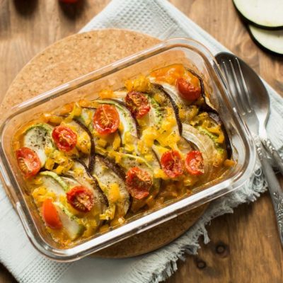 Vegetable Ratatouille in Baking Dish on Cork Pad with Silverware | Vitacost.com/blog